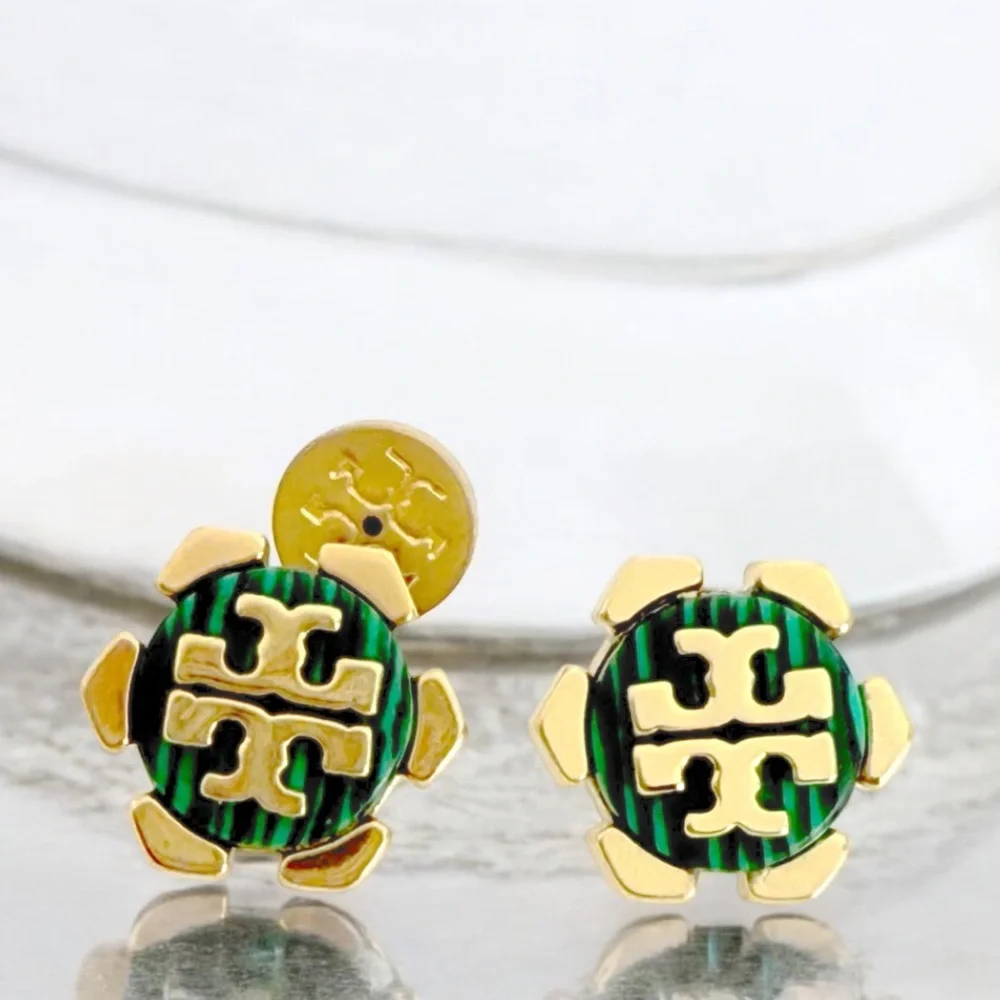 Tory Burch Malachite Green Hexagon stud earrings in gold.